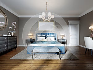 A modern bedroom in an eclectic style. With a double blue bed, black dressing table and chest of drawers with decor. beige walls