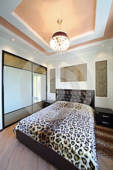 Modern bedroom in the Greek style with leopard photo