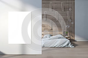 Modern bedroom interior with clean white mock up banner, bright daylight, wooden flooring, furniture and decorative objects. Style