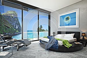 Modern bedroom with a view of a magnificent seaside ocean cove