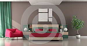 Modern bedroom with wooden double bed and red armchair