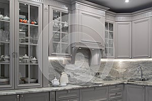 Modern beige and grey colored kitchen interior classic style with marble countertop in luxury apartment