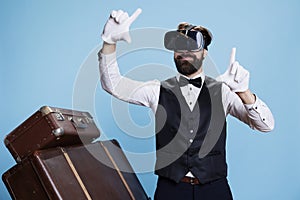 Modern bellboy using vr glasses