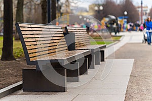 modern bench in an alley in moscow city