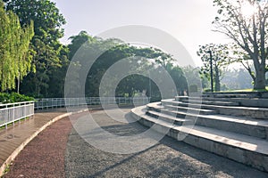 Modern benches and concrete stairway park corner bench seat for sitting. For relaxing in a landscaped park