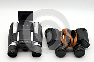 Modern binoculars and vintage binoculars isolated on white background.