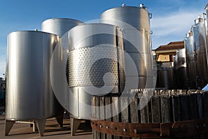 Modern bio wine production factory in Italy, inox steel tanks us