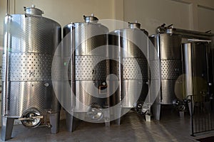 Modern bio wine production factory in Italy, inox steel tanks us photo