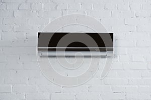 modern black air conditioner hanging on white