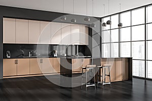 Modern black and beige kitchen. Corner view
