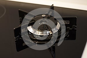 Modern black gas stove close-up, top view