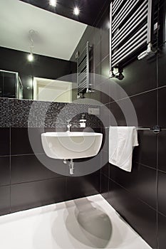 Modern black tiled bathroom