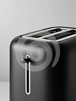 Modern black toaster in minimalistic kitchen setting.