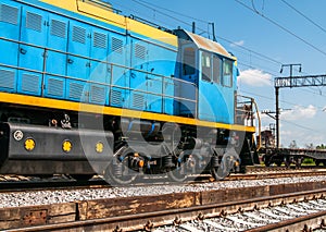 A modern blue diesel locomotive