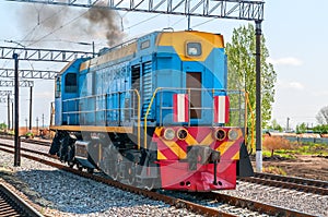 A modern blue diesel locomotive