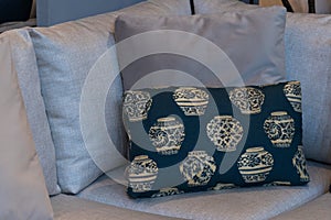 Modern blue fabric pillows and checkered pattern on the cushion gray sofa