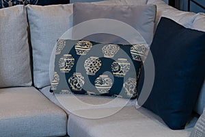 Modern blue fabric pillows and checkered pattern on the cushion gray sofa interior