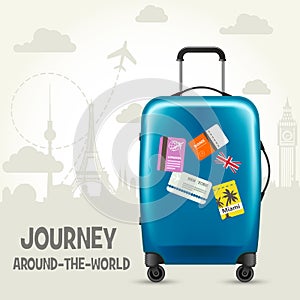 Modern blue plastic wheeled suitcase and european landmarks