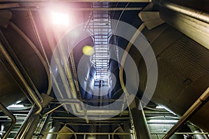 Modern brewery production line. Large vats for beer  fermentation and maturation. Bottom view