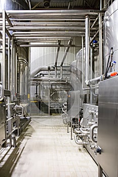 Modern brewery, steel vats and pipeline, other equipment machinery tools for beer production