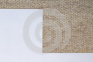 Modern brick wall with white painted plaster background