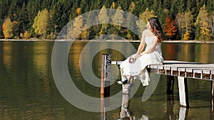 Modern bride lady with sneakers on pontoon