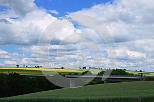 Modern bridge between agricultural fields