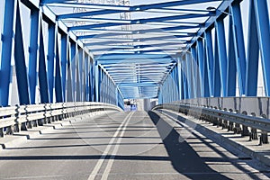 Modern bridge construction and road going through the bridge