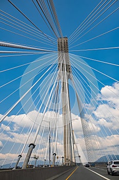 Modern bridge pylon against a blue sky. Detail of the multi-span Cable-stayed suspension Alex Fraiser Bridge BC