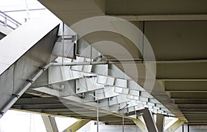 Modern bridge span over a highway.