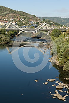 Modern bridge and water reflection