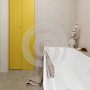 Modern bright bathroom with lamella wall. Big white bath with brown towel and cotton photo