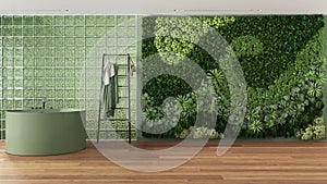 Modern bright bathroom with round bathtub and decors in green tones. Glass brick walls, vertical garden, parquet and decors.