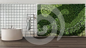 Modern bright bathroom with round bathtub and decors in white tones. Glass brick walls, vertical garden, dark parquet and decors.