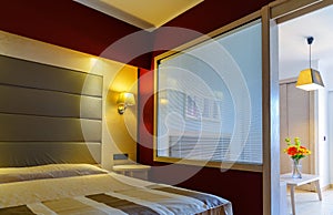 Modern bright bedroom interior 1in a luxury house, hotel.