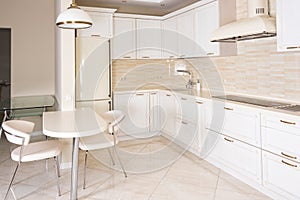 Modern, bright, clean kitchen interior in a luxury house. Interior design with classic or vintage elements. Practical