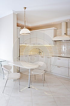 Modern, bright, clean kitchen interior in a luxury house. Interior design with classic or vintage elements. Practical