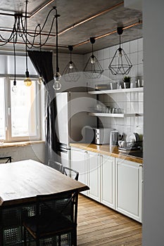 Modern, bright, clean, kitchen interior with stainless steel appliances in a luxury house. Kitchen in luxury mansion