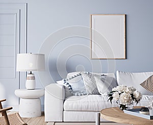 Modern bright living room in costal style, white sofa and wooden furniture on light blue wall background photo