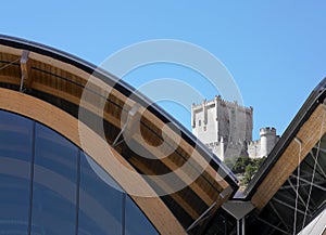 Modern building against old spanish castle