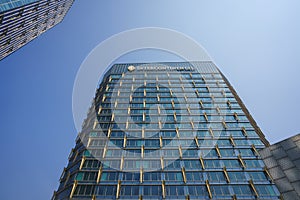 Modern building architecture, the InterContinental Hotel exterior against blue sky in Quanzhou, China