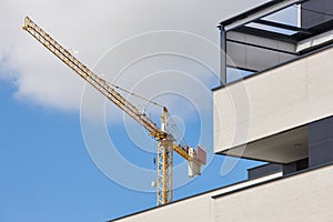 Modern building and crane machinery structure. Construction industry