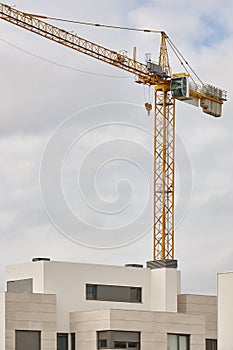 Modern building and crane machinery structure. Construction industry