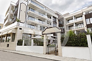 Modern Building Exterior. Facade of a Modern Apartment Building. Vacation Complex Hotel Building, With Stone Tiling Facade