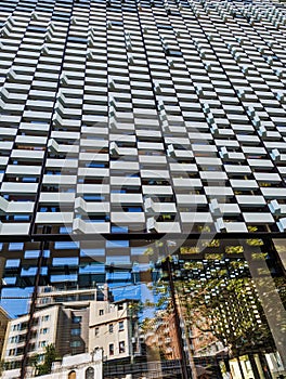 Modern Building Facade With Reflections of Older Buildings