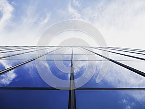 Modern building Glass facade with Sky reflection Architecture details