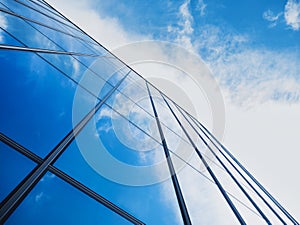 Modern building Glass facade with Sky reflection Architecture details