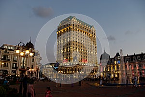 Modern building and historic building on the beach in Batumi