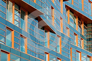 Modern building mirror facade in blue tone