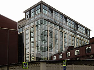 Modern building among old constructions in center of Moscow.